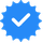 Blue verification checkmark badge with a white check symbol inside a circle of smaller blue dots.